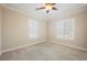 Bright bedroom with neutral carpeting and window shutters at 2768 Liberation Dr, Henderson, NV 89044