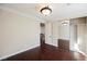 Bedroom with hardwood floors, mirrored closet, and access to upper loft at 2768 Liberation Dr, Henderson, NV 89044