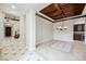 Formal dining room with coffered ceiling and tile flooring at 2768 Liberation Dr, Henderson, NV 89044