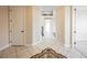 View down the hallway with tile floors and staircase at 2768 Liberation Dr, Henderson, NV 89044