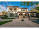 Two-story house with stone accents and a covered patio at 2768 Liberation Dr, Henderson, NV 89044