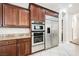 Kitchen boasting stainless steel appliances and ample wood cabinetry at 2768 Liberation Dr, Henderson, NV 89044