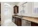 Kitchen featuring a double sink, granite counters, and stainless steel appliances at 2768 Liberation Dr, Henderson, NV 89044