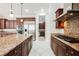 Spacious kitchen with granite countertops and stainless steel appliances at 2768 Liberation Dr, Henderson, NV 89044