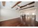 Bright living room featuring hardwood floors, high ceilings, exposed beams, and a loft view at 2768 Liberation Dr, Henderson, NV 89044