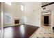 High-ceilinged living room with hardwood floors and fireplace at 2768 Liberation Dr, Henderson, NV 89044