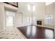 Bright living room featuring hardwood floors and a fireplace at 2768 Liberation Dr, Henderson, NV 89044