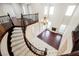 Elegant curved staircase overlooking the main floor at 2768 Liberation Dr, Henderson, NV 89044