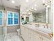 Modern bathroom with double sinks and a large shower at 3074 Monte Rosa Ave, Las Vegas, NV 89120