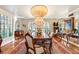 Elegant dining room with hardwood floors, a large table, and a crystal chandelier at 3074 Monte Rosa Ave, Las Vegas, NV 89120