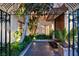 Inviting entryway with ornate gate and lush landscaping at 3074 Monte Rosa Ave, Las Vegas, NV 89120