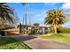 Grand home exterior with palm trees at 3074 Monte Rosa Ave, Las Vegas, NV 89120