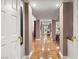 Long hallway with hardwood floors and classic architecture at 3074 Monte Rosa Ave, Las Vegas, NV 89120