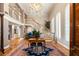 Grand foyer with curved staircase and chandelier at 3074 Monte Rosa Ave, Las Vegas, NV 89120