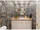 Powder room with unique wallpaper and a modern vanity at 3074 Monte Rosa Ave, Las Vegas, NV 89120