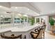 Elegant wet bar, great for entertaining, with seating and glass shelving at 3074 Monte Rosa Ave, Las Vegas, NV 89120