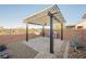 Backyard patio features a pergola, ceiling fan, and grill at 3096 Beaux Art Ave, Henderson, NV 89044