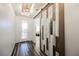 Bright entryway with stylish barn door and wood-look floors at 3096 Beaux Art Ave, Henderson, NV 89044