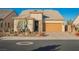 Single-story home with desert landscaping and two-car garage at 3096 Beaux Art Ave, Henderson, NV 89044