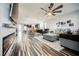 Open living area features hardwood floors and a view into the kitchen at 3096 Beaux Art Ave, Henderson, NV 89044