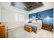 Spacious main bedroom with blue accent wall and wood ceiling at 3096 Beaux Art Ave, Henderson, NV 89044