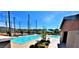 Community pool with adjacent restrooms and seating area at 3096 Beaux Art Ave, Henderson, NV 89044