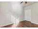 Bedroom featuring a ceiling fan, hardwood floors, base trim, and a double door closet at 3363 Blue Ribbon Downs St, Las Vegas, NV 89122