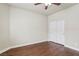 Bedroom featuring a ceiling fan, hardwood floors, base trim, and a double door closet at 3363 Blue Ribbon Downs St, Las Vegas, NV 89122