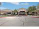 Exterior view of the community clubhouse surrounded by well-maintained landscaping at 3363 Blue Ribbon Downs St, Las Vegas, NV 89122