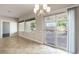 Dining room with chandelier, sliding door and big windows to the outdoor patio at 3363 Blue Ribbon Downs St, Las Vegas, NV 89122