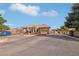 View of the community entrance featuring a guardhouse and landscaping at 3363 Blue Ribbon Downs St, Las Vegas, NV 89122