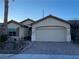 One-story home with attached garage and landscaped front yard at 3363 Blue Ribbon Downs St, Las Vegas, NV 89122