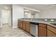 Well-lit kitchen featuring granite countertops, stainless steel appliances and decorative tile flooring at 3363 Blue Ribbon Downs St, Las Vegas, NV 89122