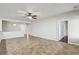 Open living space with tile floors, ceiling fan, and white walls at 3363 Blue Ribbon Downs St, Las Vegas, NV 89122