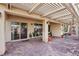 Covered patio featuring a pergola, circular brick pavers and access to the backyard at 3363 Blue Ribbon Downs St, Las Vegas, NV 89122