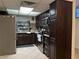 Dark wood kitchen cabinets with stainless steel appliances at 3712 San Joaquin Ave, Las Vegas, NV 89102