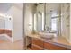 Modern bathroom with a vessel sink, floating vanity, and a large mirror reflecting the bedroom at 3726 Las Vegas Blvd # 2702, Las Vegas, NV 89158