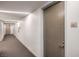 Condo hallway with neutral walls and carpet leading to unit number 2702 at 3726 Las Vegas Blvd # 2702, Las Vegas, NV 89158