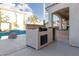 Outdoor built-in BBQ station next to the pool at 3925 Larkcrest St, Las Vegas, NV 89129