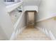 Elegant basement stairs with tile flooring and a window overlooking the backyard at 3925 Larkcrest St, Las Vegas, NV 89129