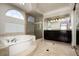 Bathroom boasts a large soaking tub and walk-in shower at 3925 Larkcrest St, Las Vegas, NV 89129