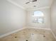 Bedroom with arched window and tile floors at 3925 Larkcrest St, Las Vegas, NV 89129