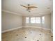 Bedroom with bay window, tile floors and ceiling fan at 3925 Larkcrest St, Las Vegas, NV 89129