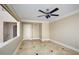 Bright bonus room with ceiling fan and tile flooring at 3925 Larkcrest St, Las Vegas, NV 89129