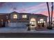 Two-story house with a three-car garage and landscaped front yard at 3925 Larkcrest St, Las Vegas, NV 89129