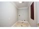 Laundry room with tile floor and built-in cabinetry at 3925 Larkcrest St, Las Vegas, NV 89129