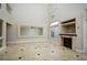 High-ceilinged living room with fireplace and tile floors at 3925 Larkcrest St, Las Vegas, NV 89129