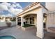 Covered patio with ceiling fan and artificial turf at 3925 Larkcrest St, Las Vegas, NV 89129