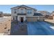 Two-story house with a two-car garage and landscaped yard at 3981 E Teller Dr, Pahrump, NV 89061