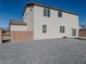 Two story house exterior with stone and light colored siding at 3981 E Teller Dr, Pahrump, NV 89061